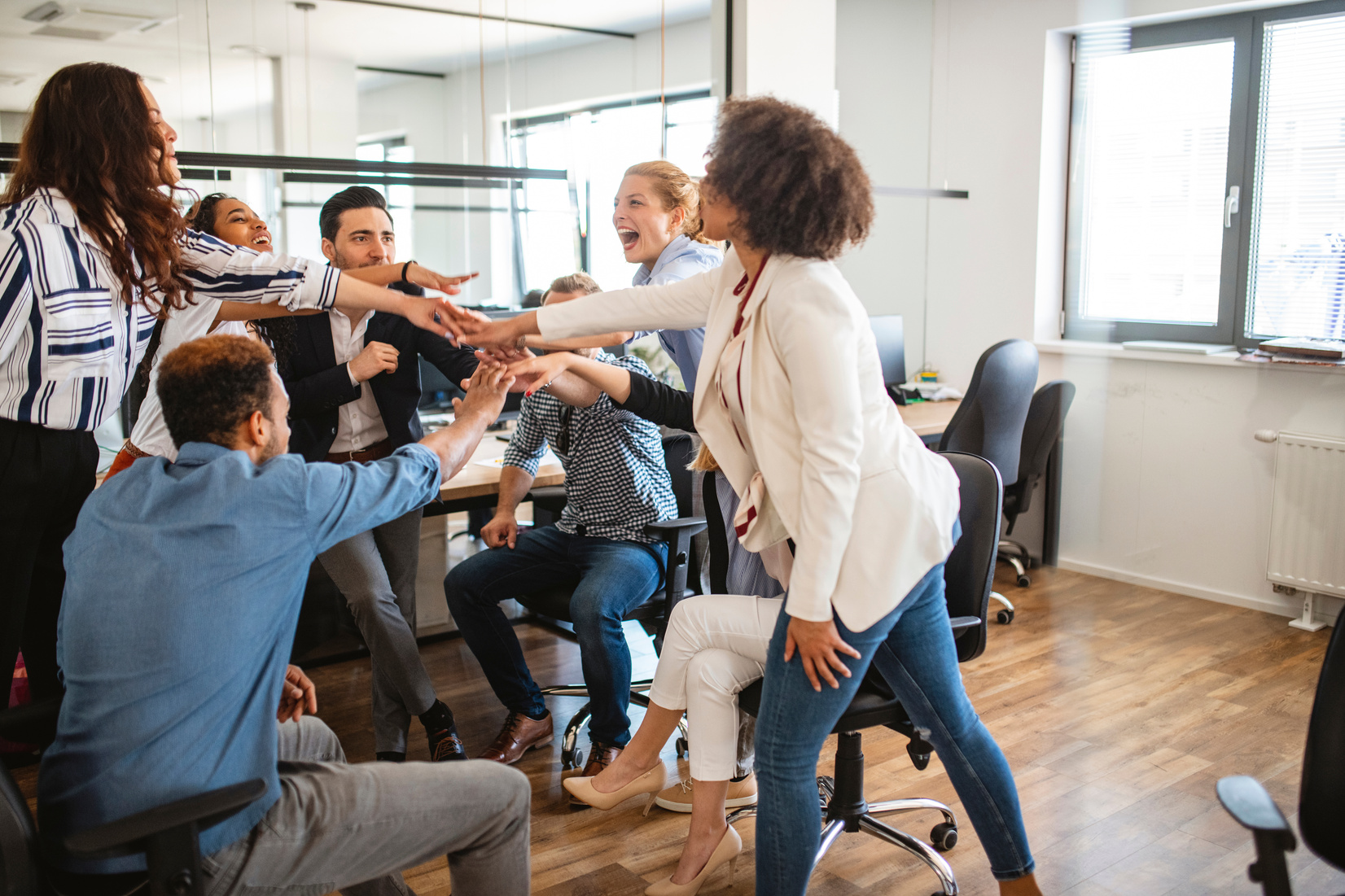 Energetic Young Businesspeople Celebrating Work Team Success